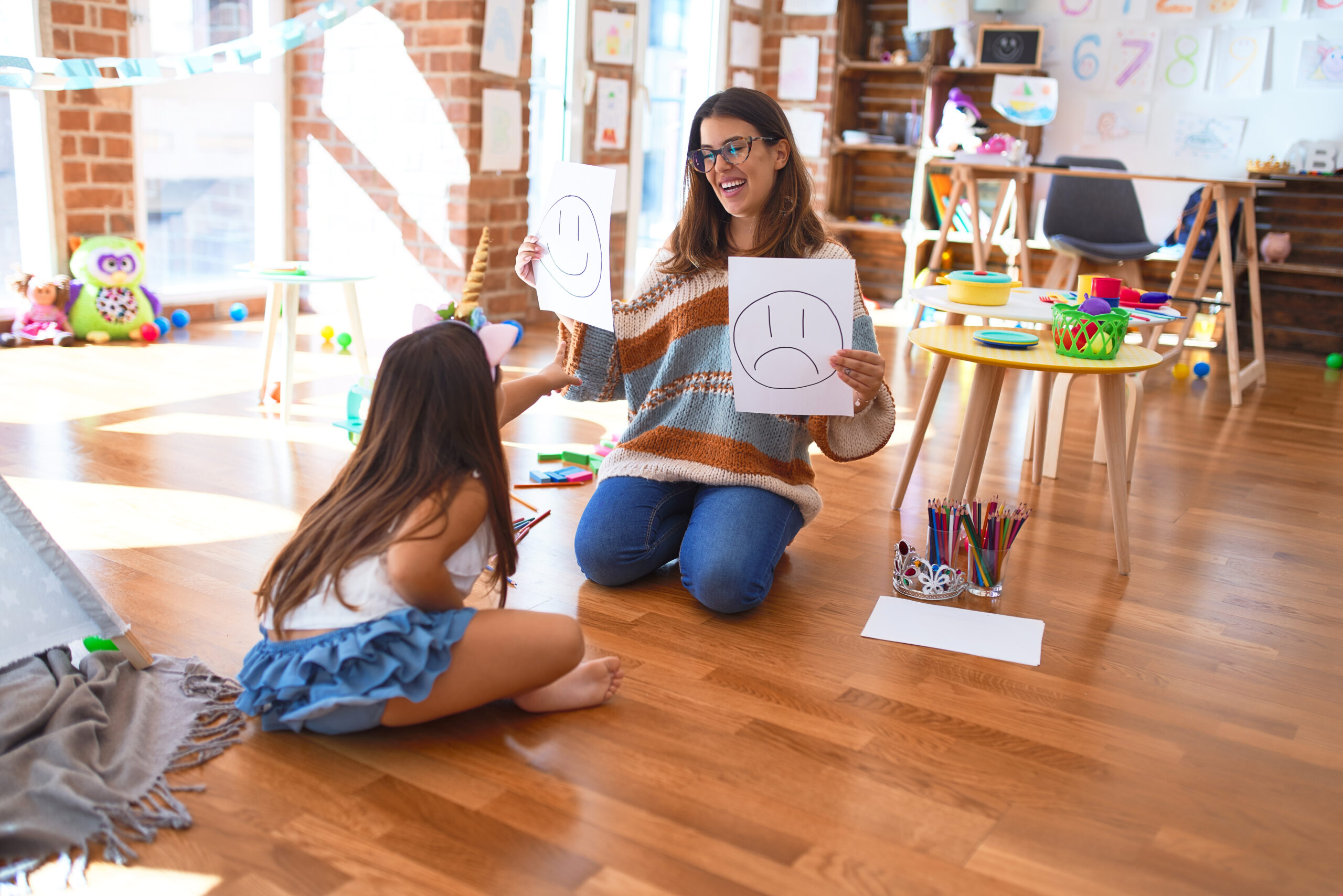 Beautiful,Pshychologist,And,Toddler,Doing,Therapy,With,Emotions,Emoji,Around
